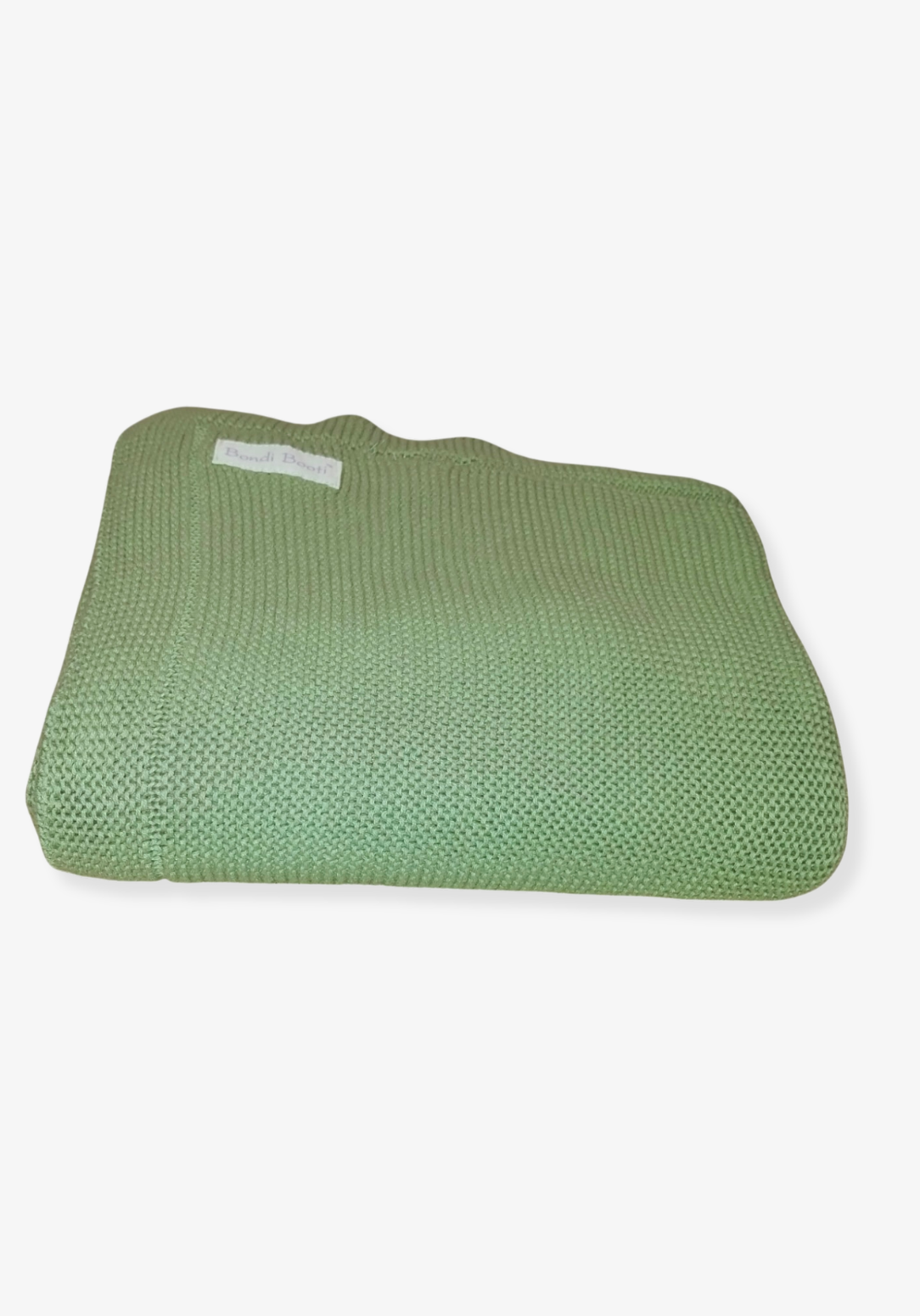 Folded green knitted baby blanket with a “Bondi Booti” label, placed on a light gray background.