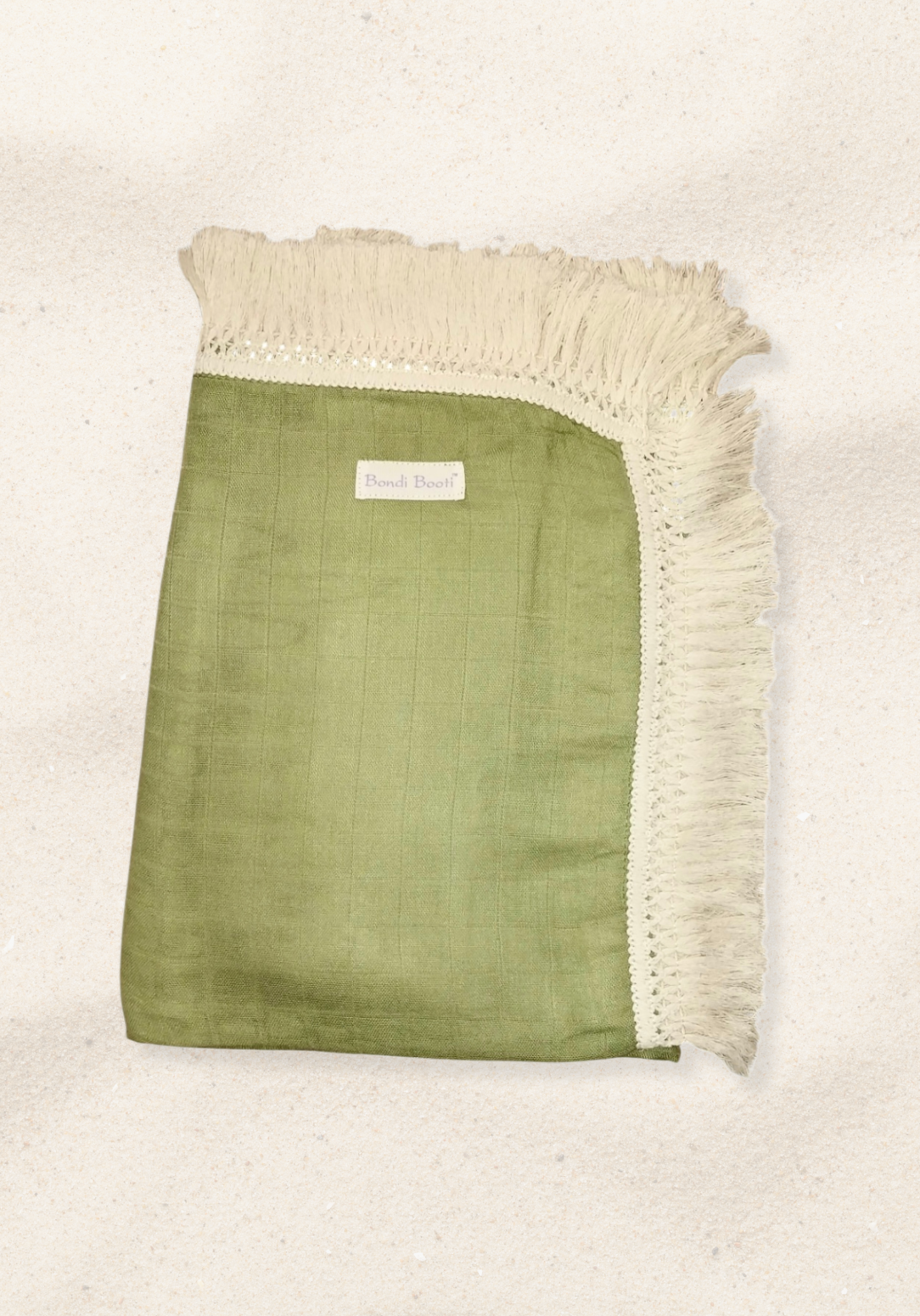 Soft green cotton baby blanket with ivory fringe, made from breathable cotton-bamboo fabric. Lightweight and cozy.