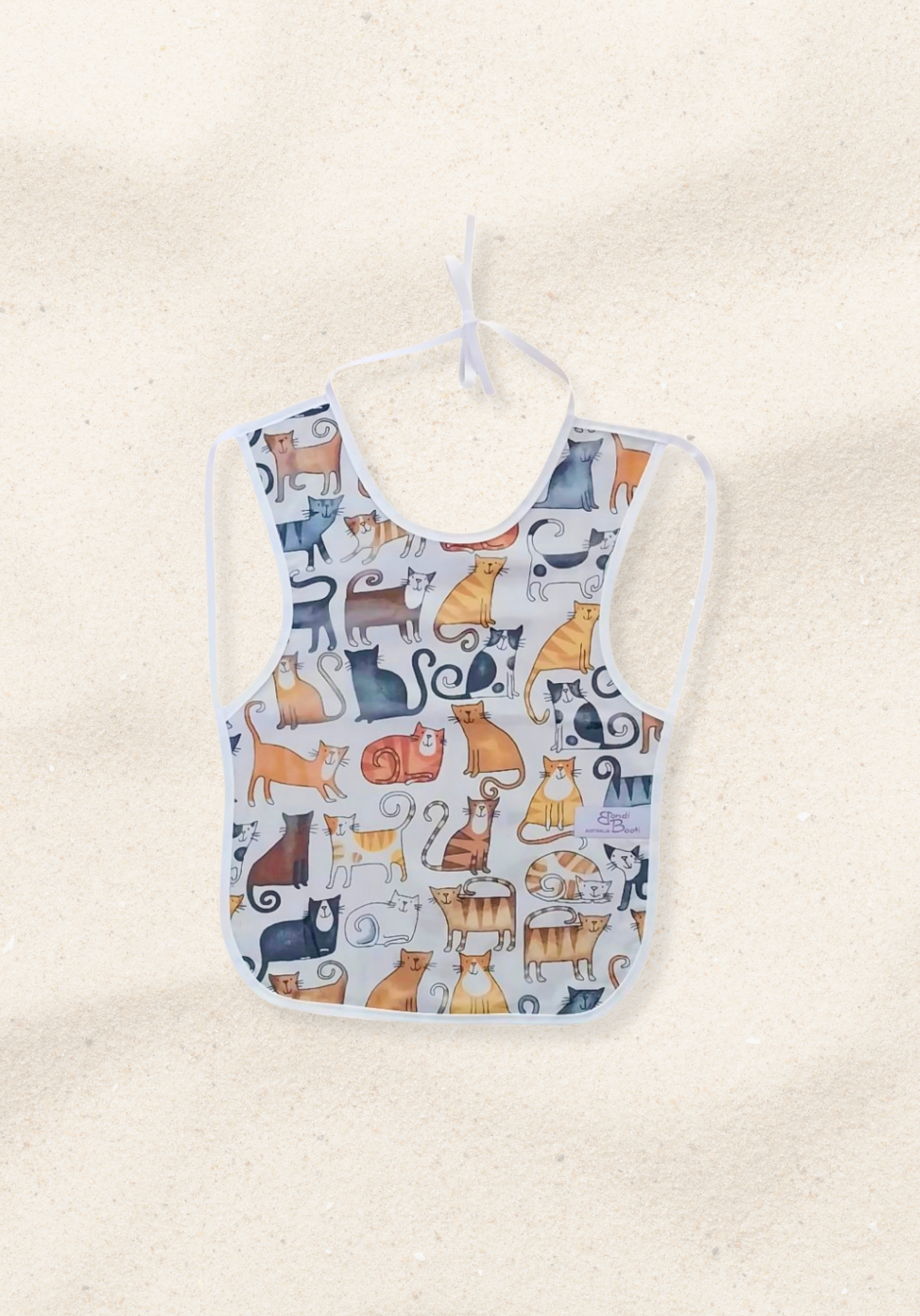 Laminated baby bib with playful cat design
