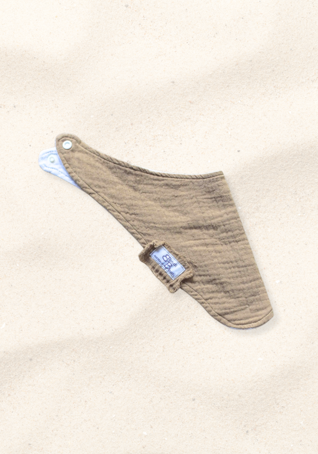 Mocha-toned bandana-style baby bib made of soft organic cotton with absorbent inner lining.