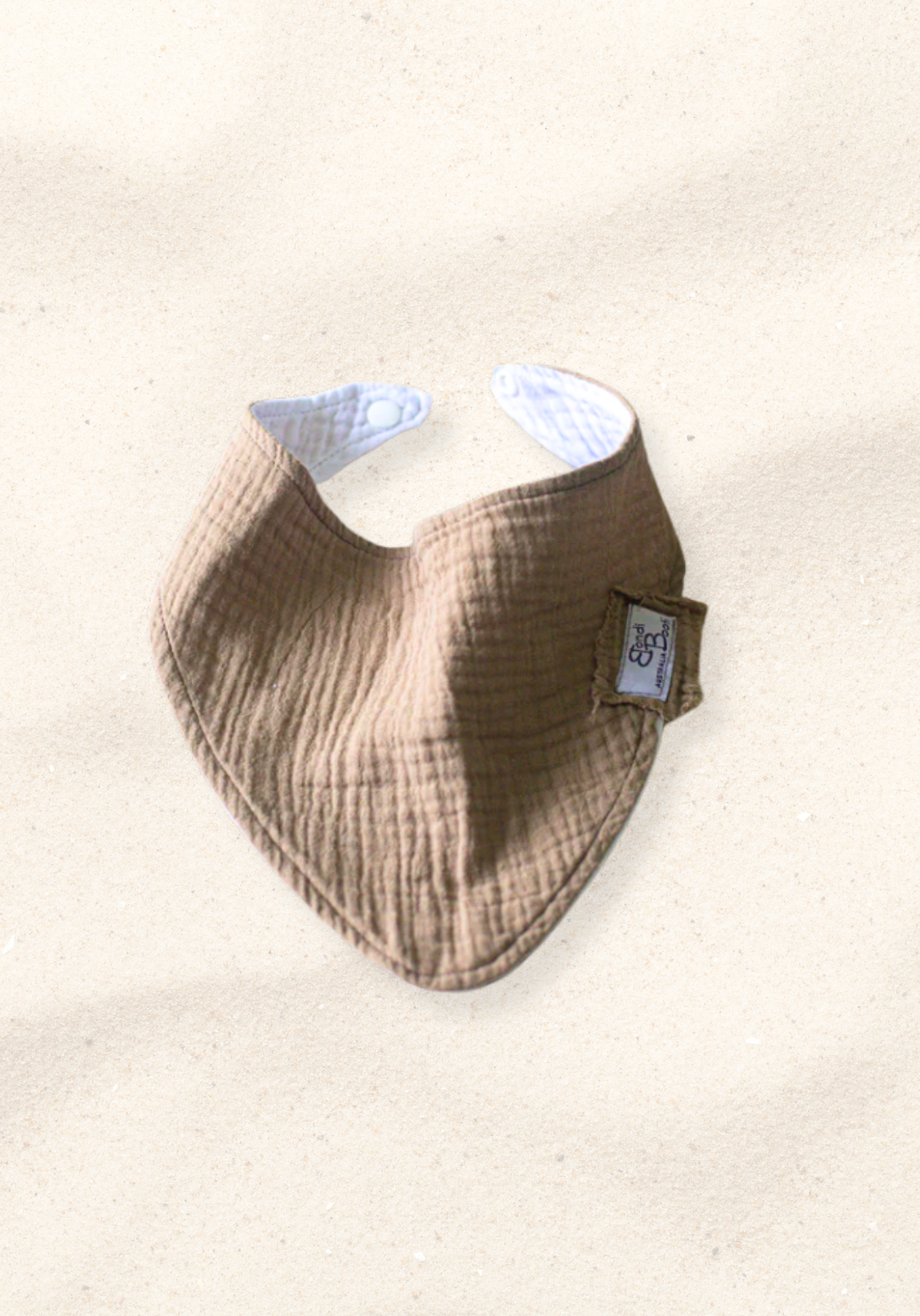 Mocha-toned bandana-style baby bib made of soft organic cotton with absorbent inner lining.