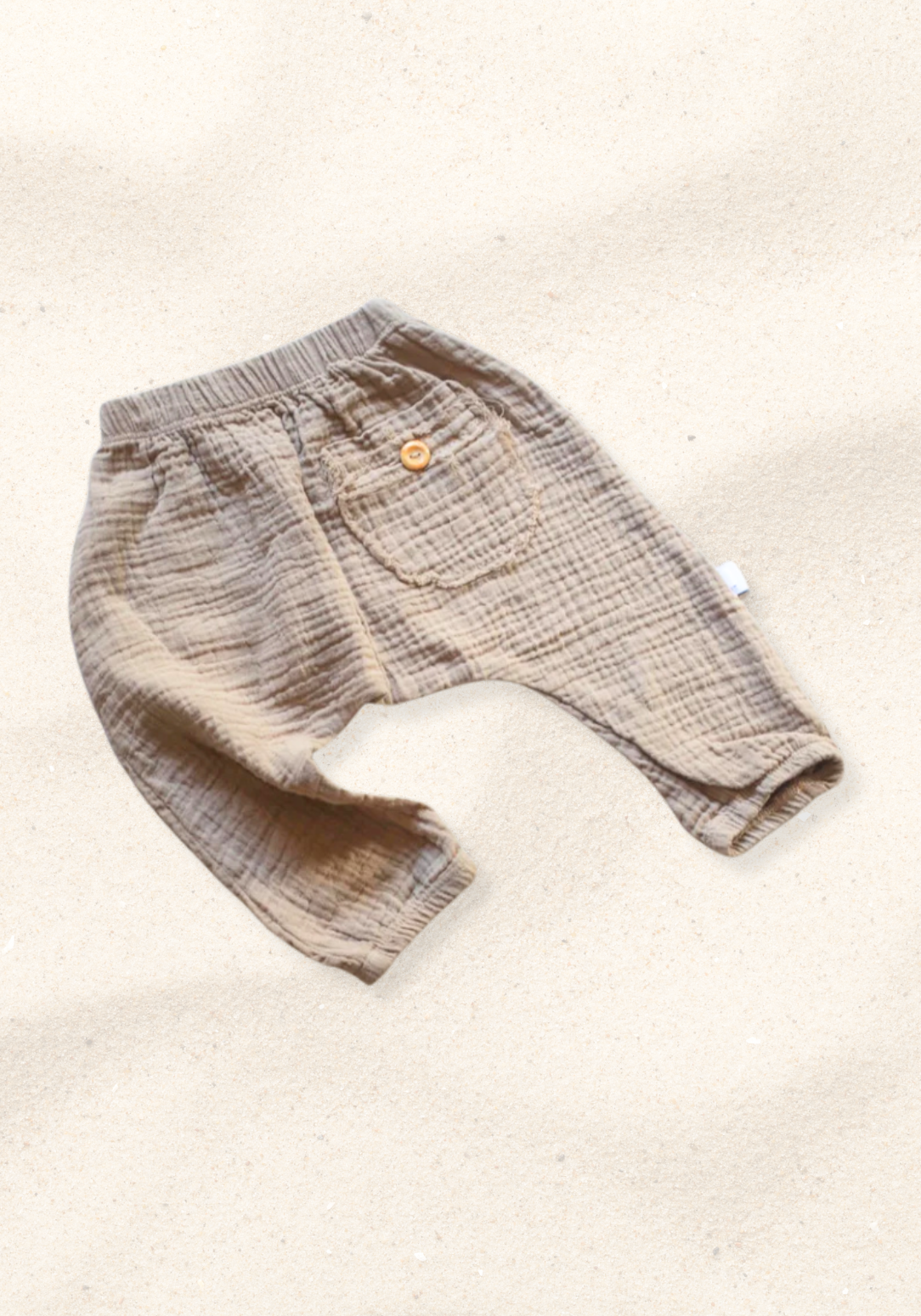 Soft mocha toddler harem pants made from breathable organic cotton with stretchy waistband and ankle cuffs.
