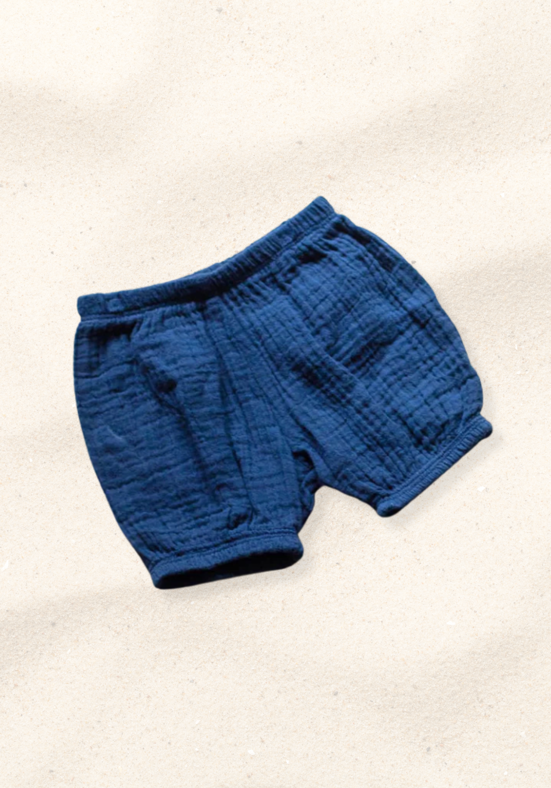 Navy blue organic cotton baby bloomers with soft elastic waist and leg openings.