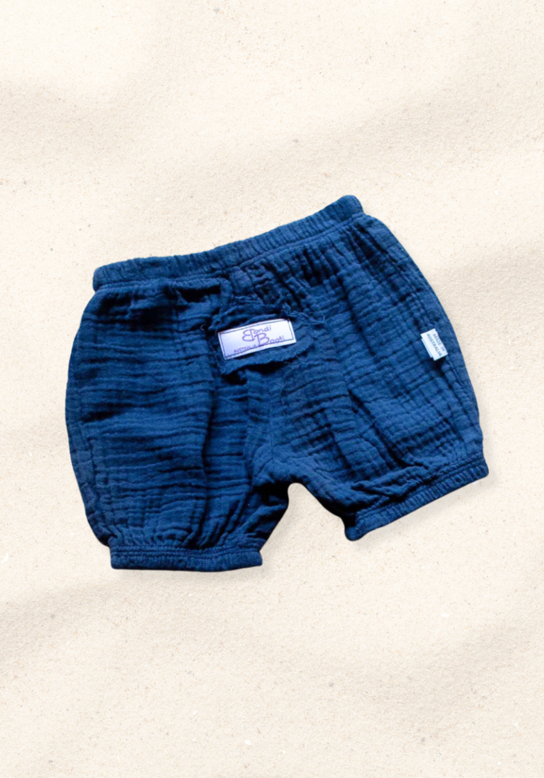 Navy blue organic cotton baby bloomers with soft elastic waist and leg openings.