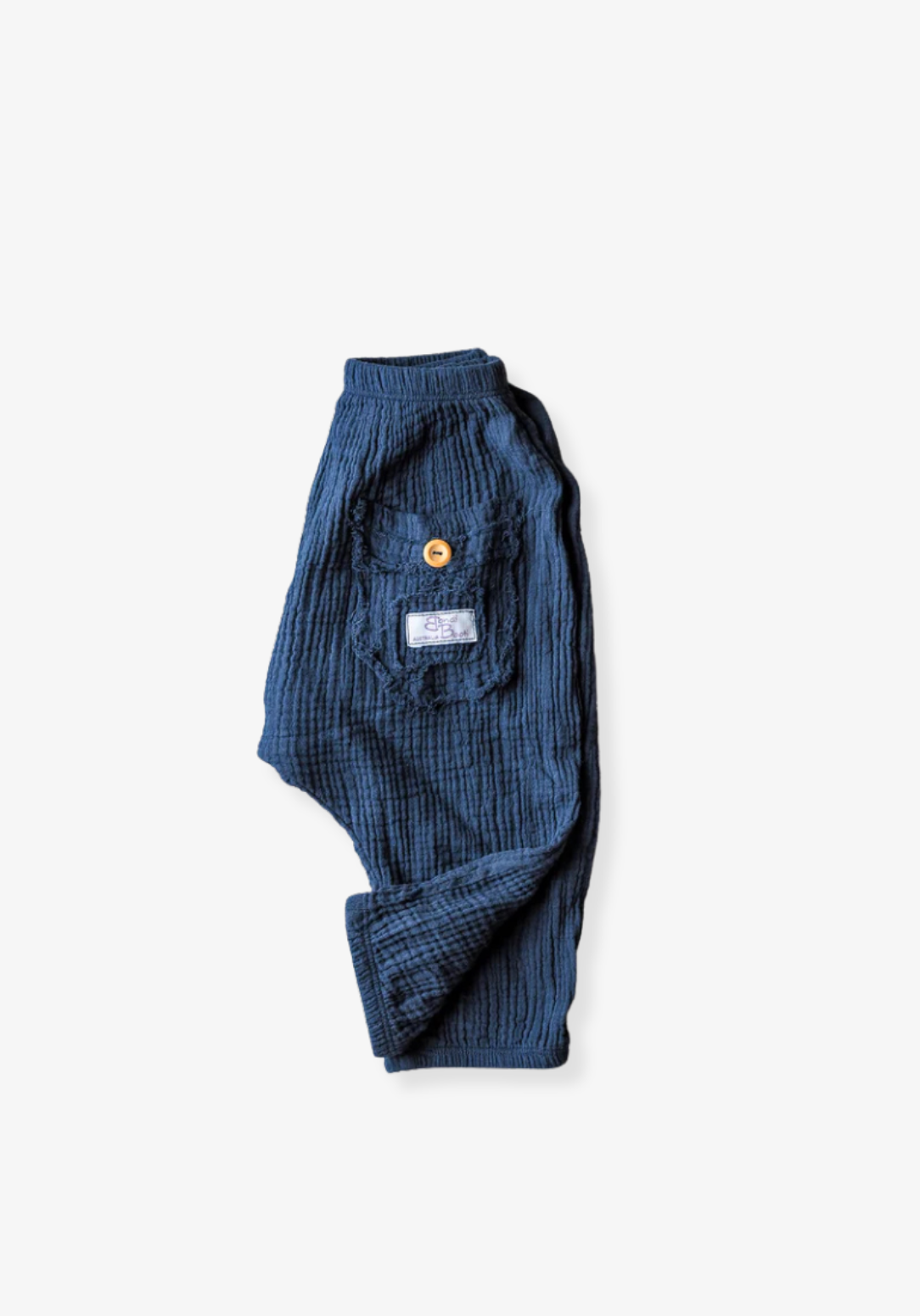 Toddler harem pants in navy blue made from organic cotton with an elastic waistband and buttoned pocket