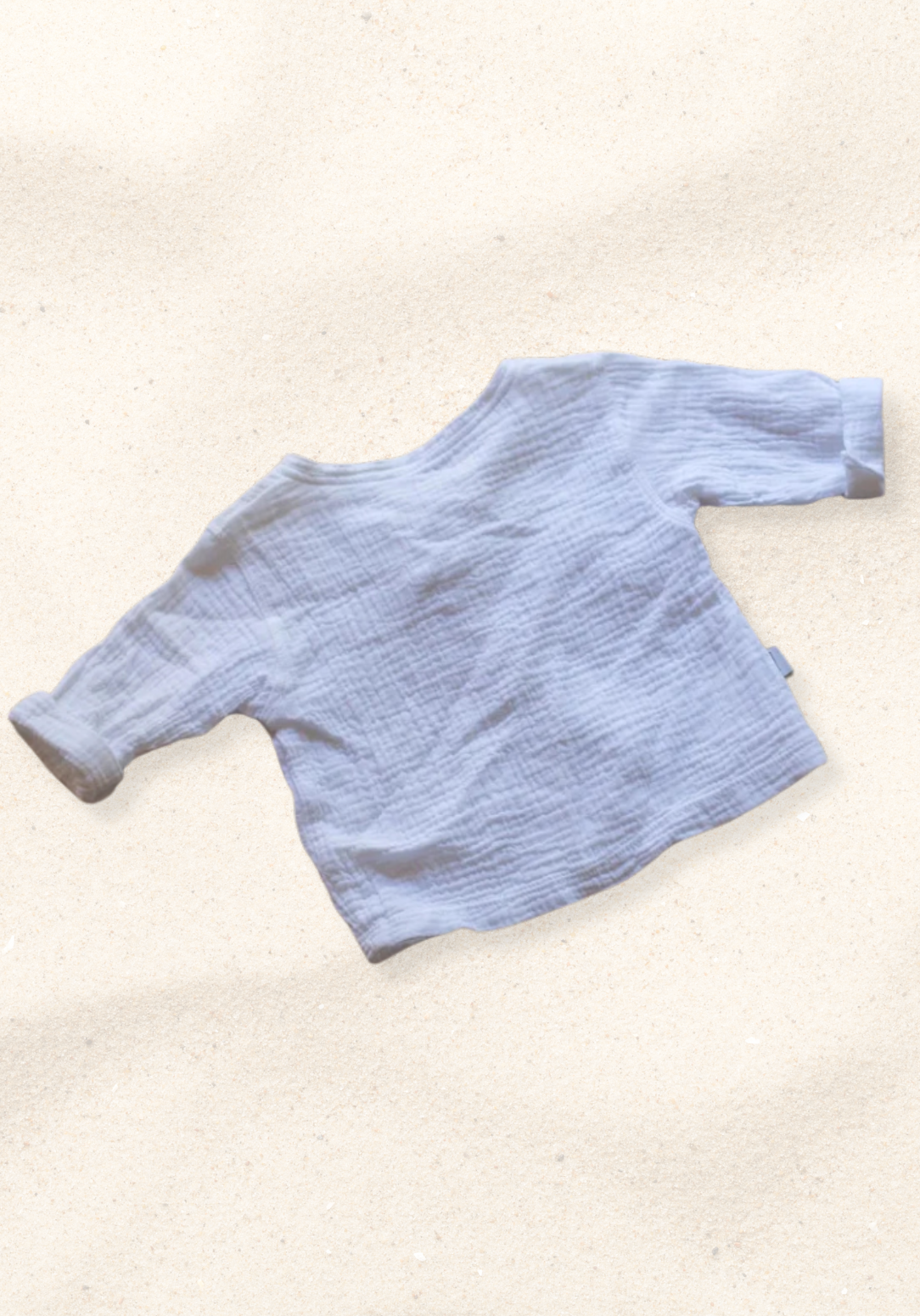 The Pirate Shirt in white made from organic cotton with wooden buttons, perfect for toddler casual wear
