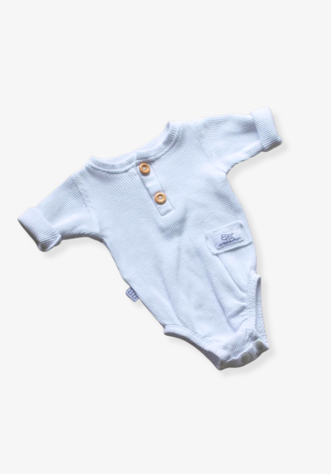 waffle knit long sleeve baby bodysuit with soft organic cotton texture and convenient snap buttons