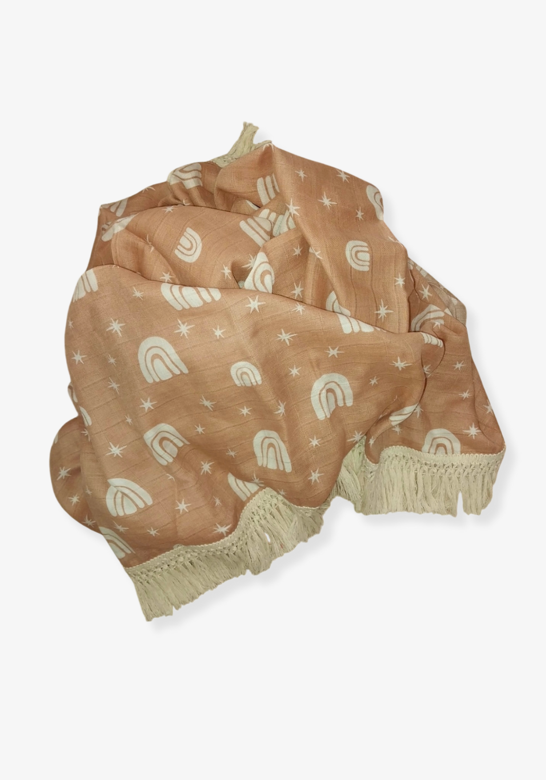 Peach baby blanket with white rainbow and star patterns, edged with cream fringe. Perfect for cozy snuggles.