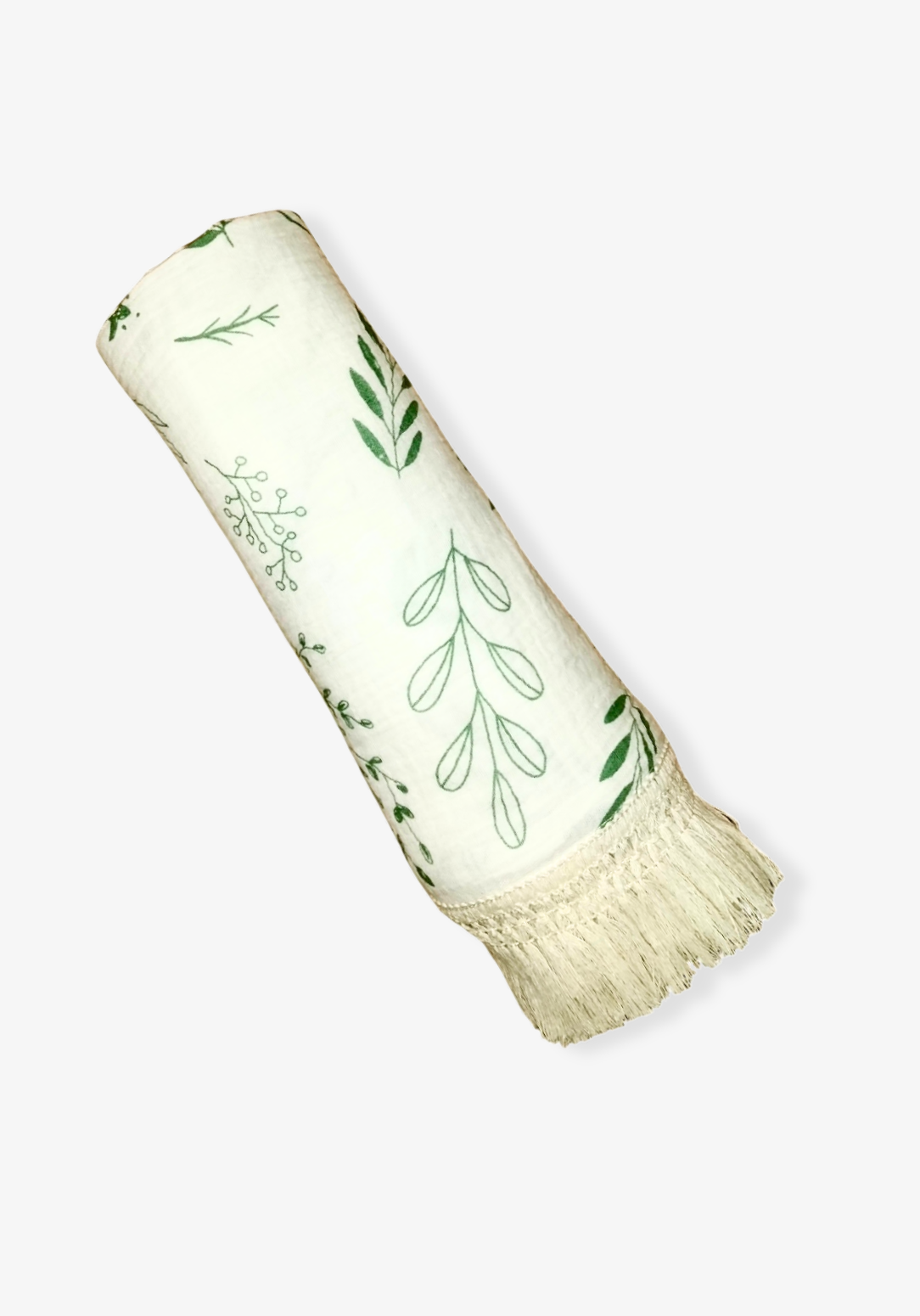 White cotton baby blanket with green botanical leaf print and boho-inspired fringe border. Naturally breathable.