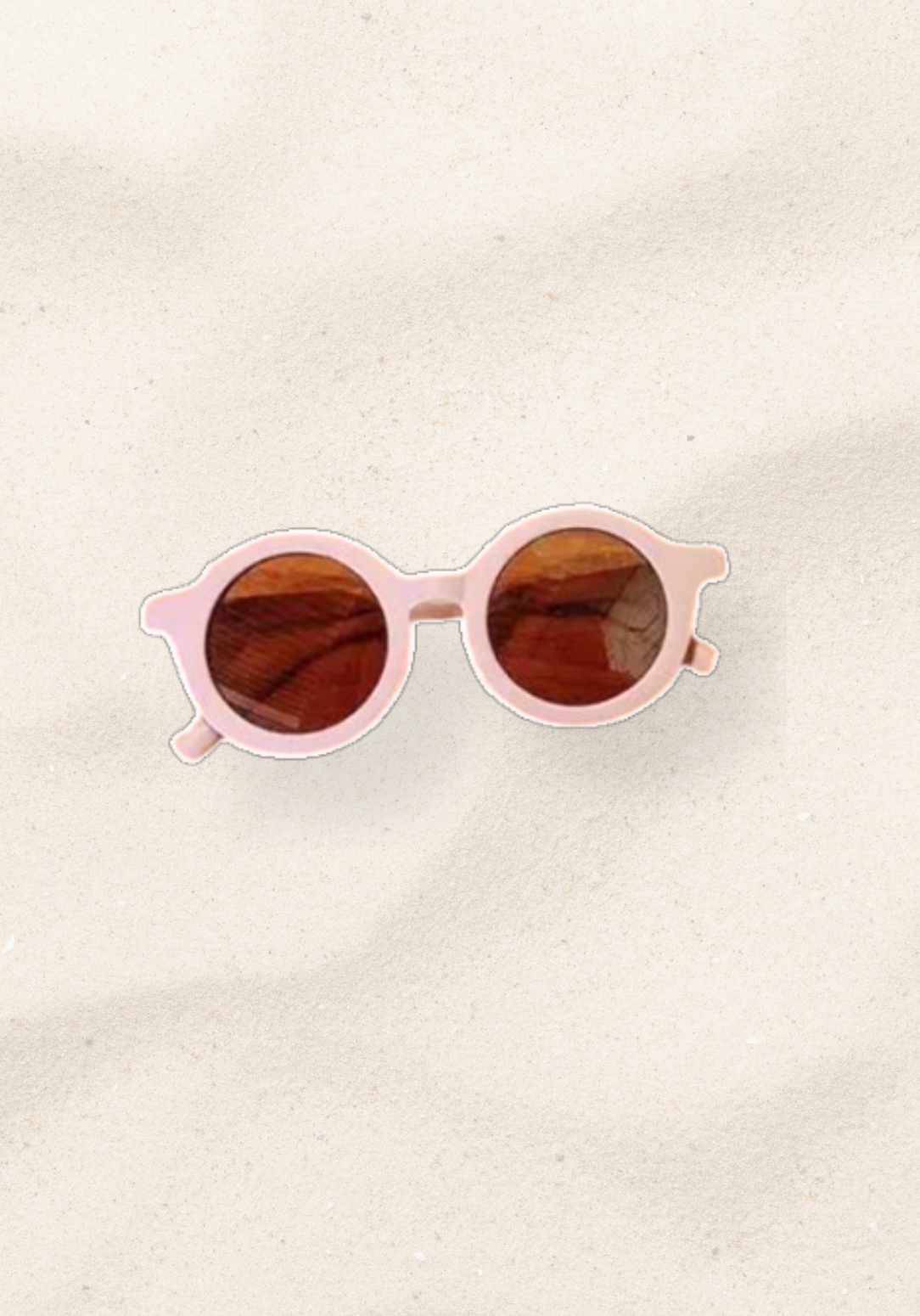 Baby pink toddler sunglasses with rounded amber lenses and soft pastel frame.