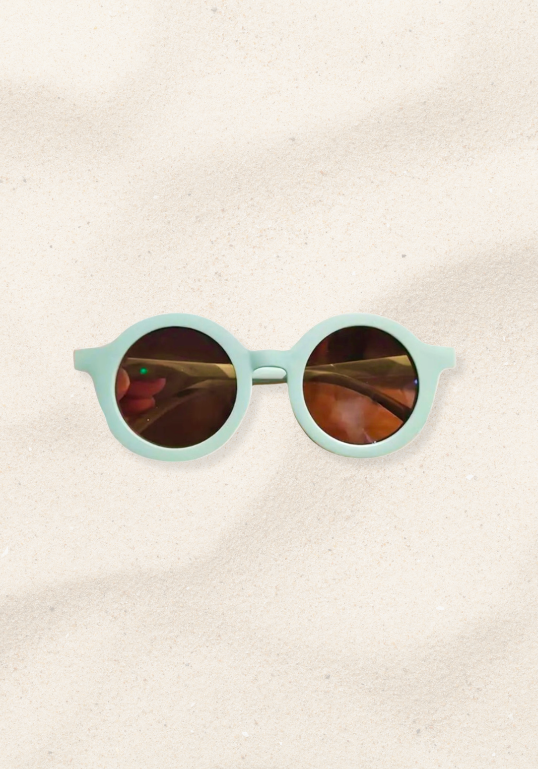 Round mint green toddler sunglasses with brown lenses and a matte frame finish.