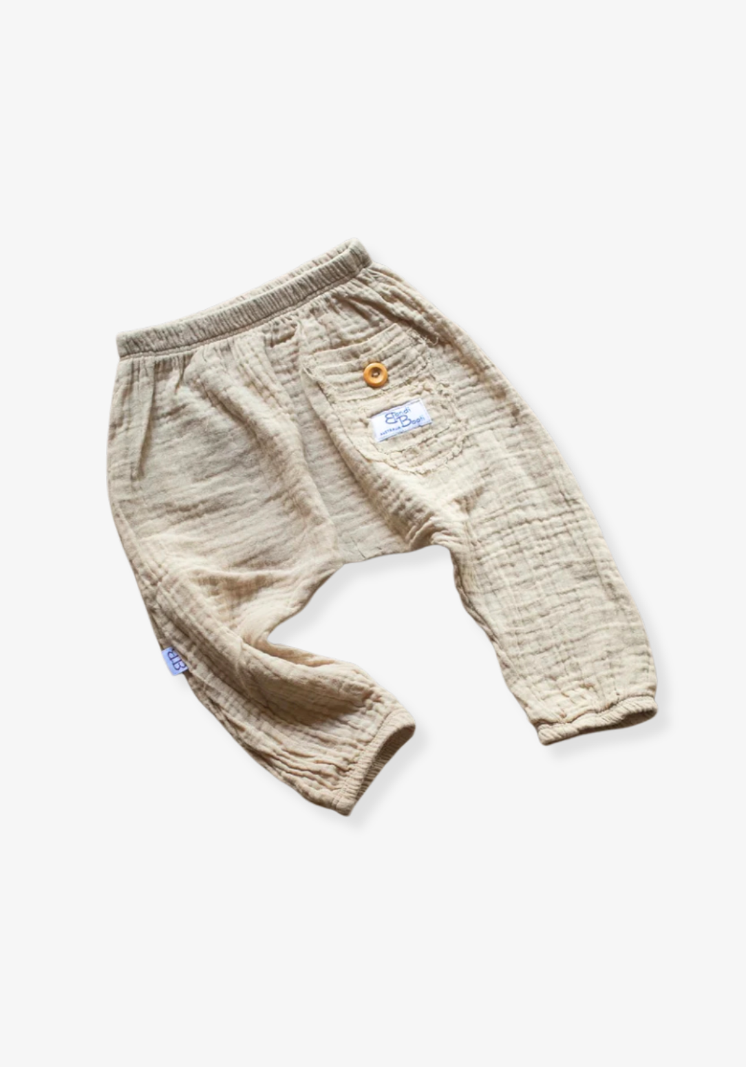 Beige organic cotton toddler harem pants with elastic waistband, wooden button, and back pocket