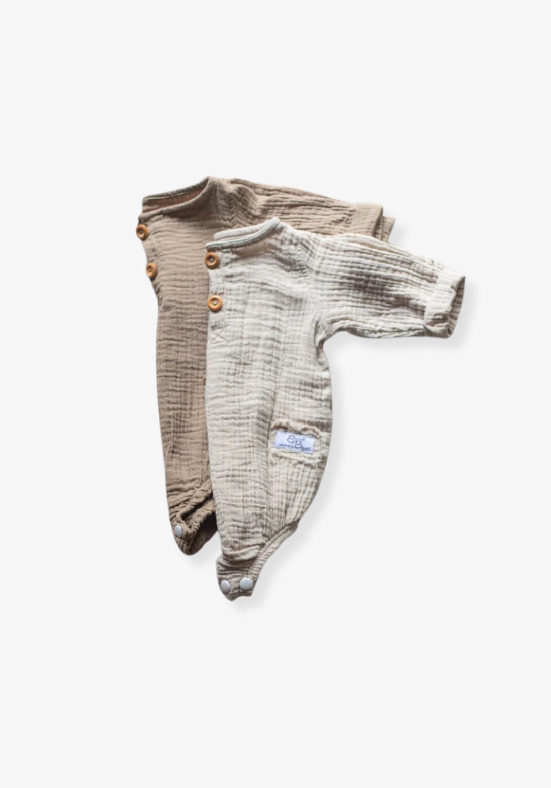 Long sleeve baby romper in mocha color crafted from organic cotton with snap closure and wood button details