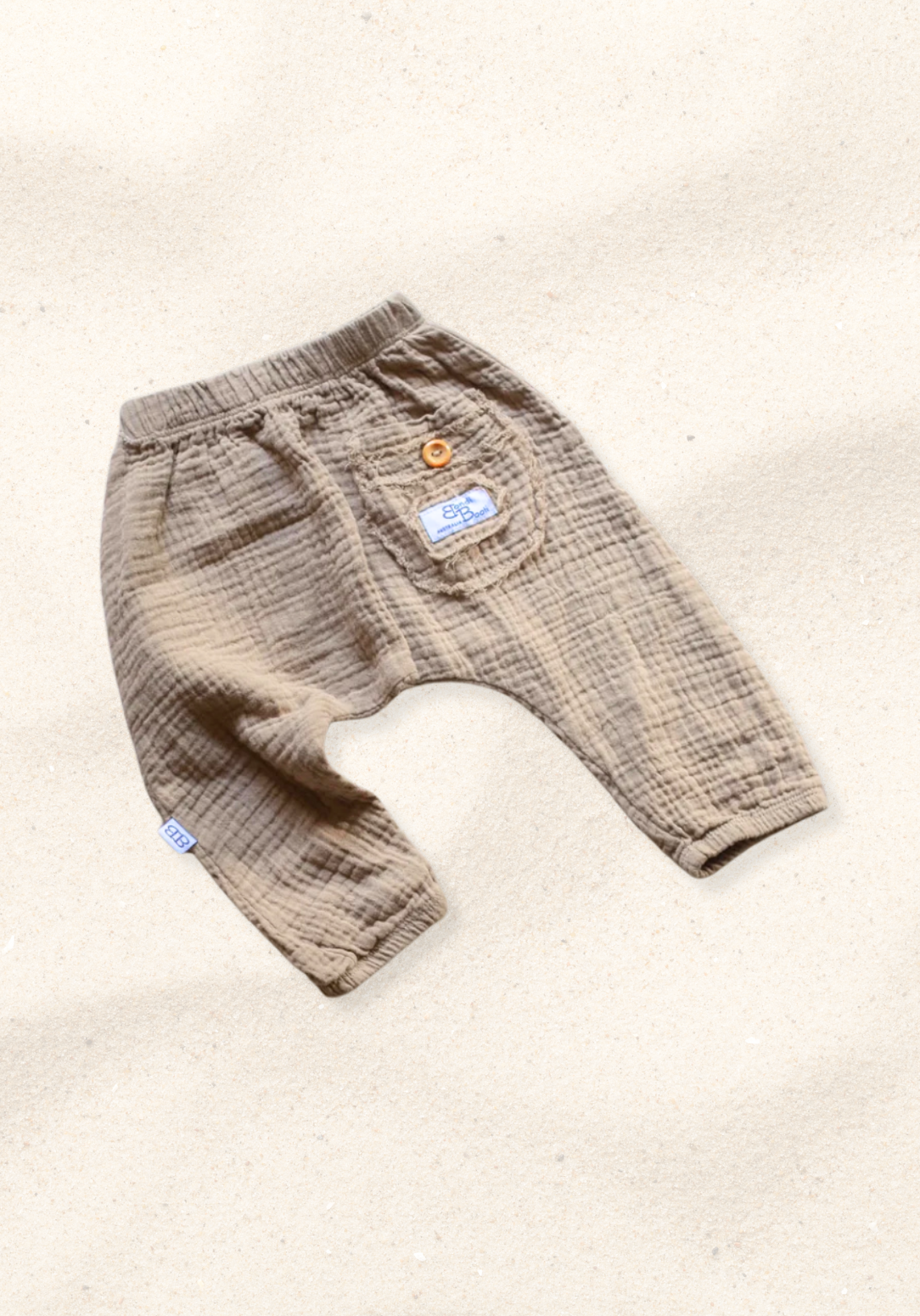 Soft mocha toddler harem pants made from breathable organic cotton with stretchy waistband and ankle cuffs.